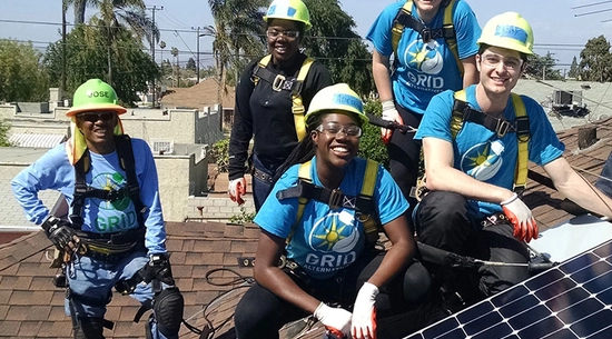 group installing solar panels
